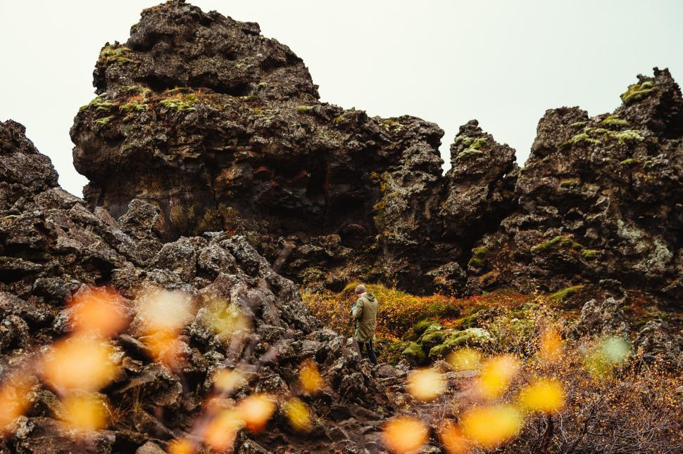 Free Image of A photographer at volcanic rocky hills 