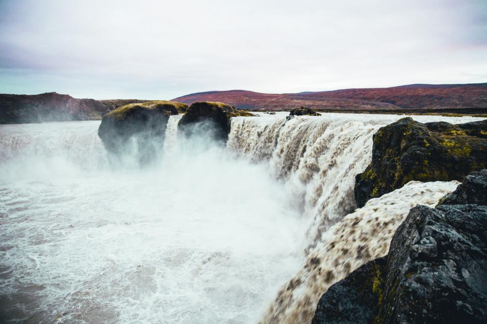 Free Image of Rapids forming waterfall in the mountains 