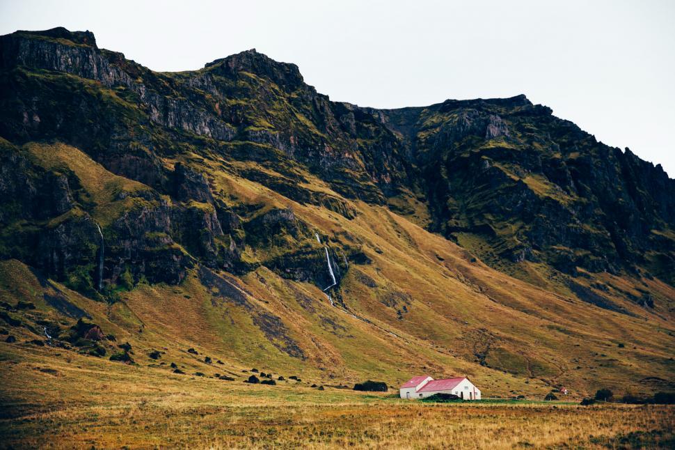 Free Image of A farm home near rocky hills 