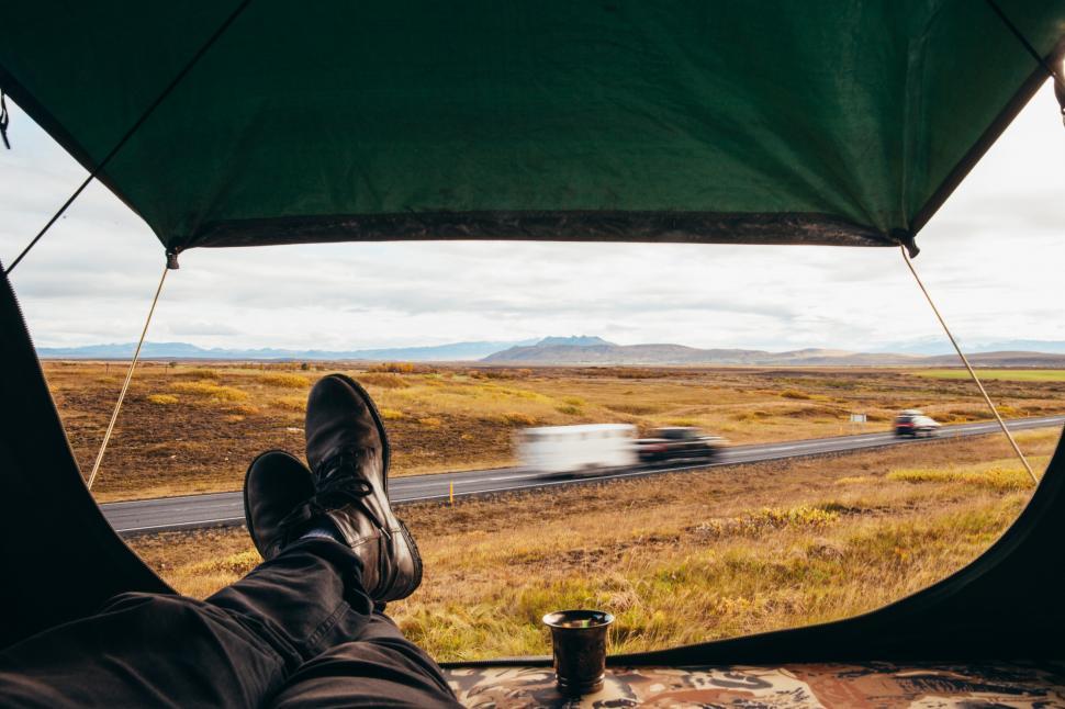 Free Image of A hiker s relaxed feet in roadside camping 