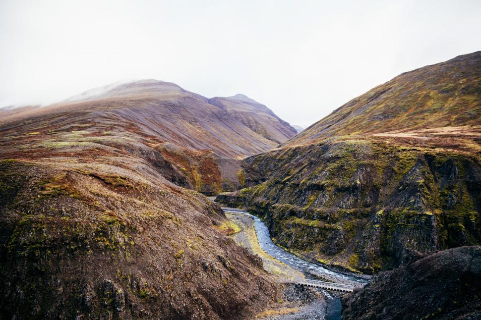 Free Image of A fresh water stream through the rocky hills 