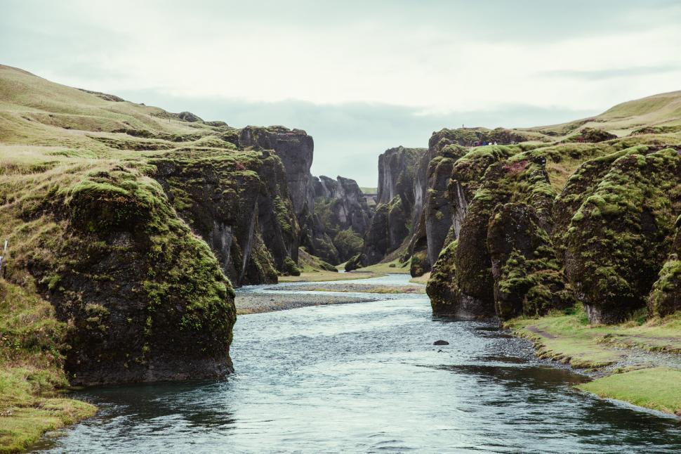 Free Image of A fresh water stream through the rocky hills 