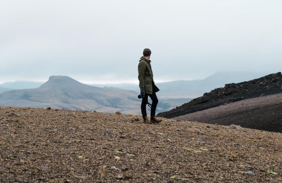 Free Image of A hiker in rocky Iceland field 