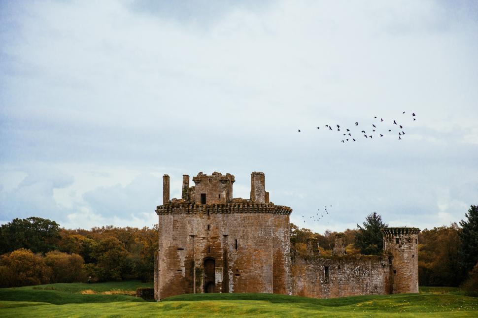 Free Image of Birds flying over Caerlaverock Castle 