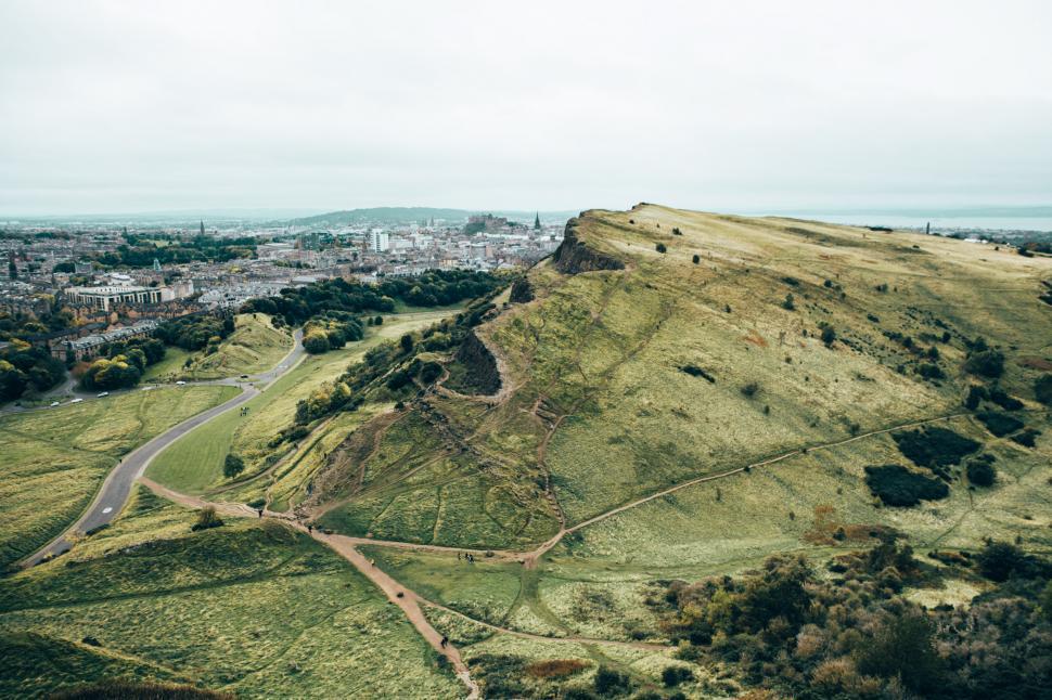 Free Image of Green hill by growing city 