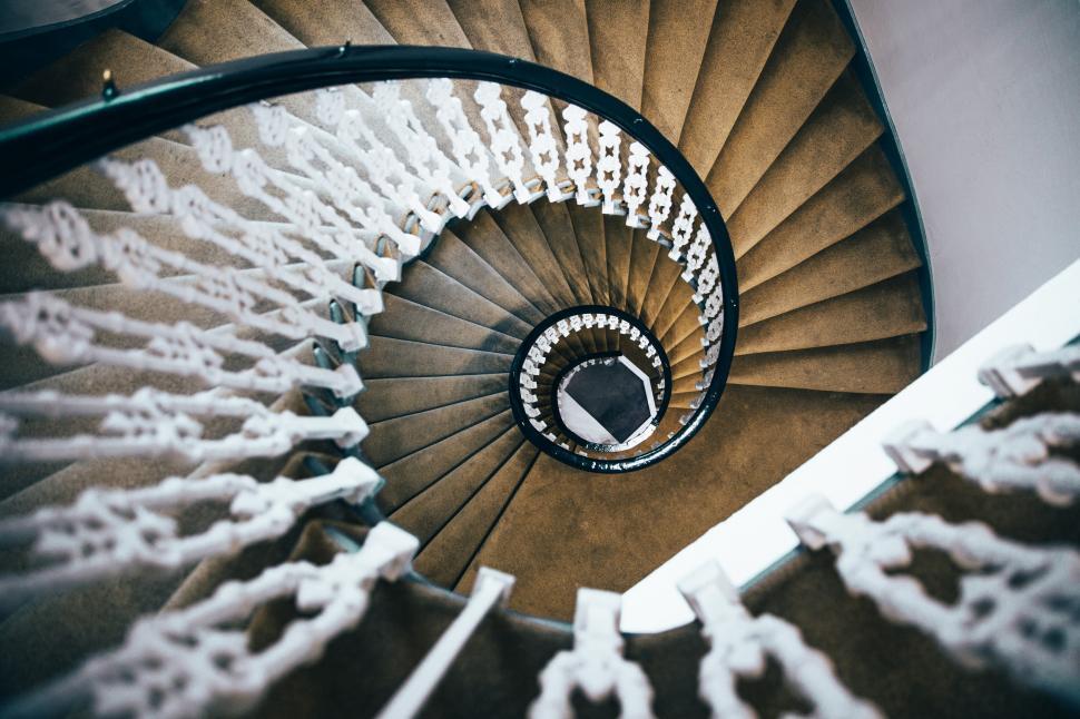 Free Image of View of a spiral staircase fom the top 