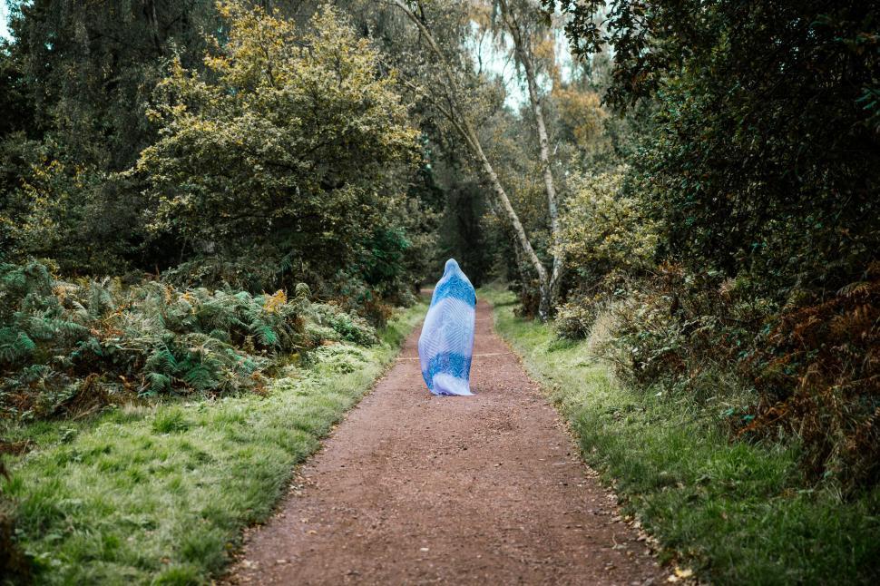 Free Image of A woman walking in the forest  