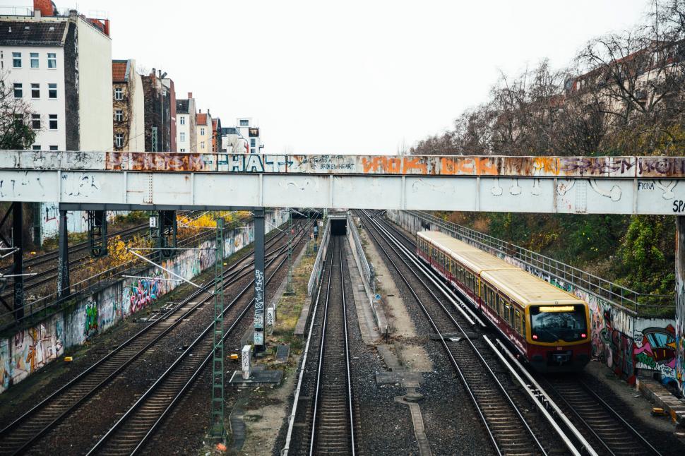 Free Image of Graffiti near a train subway bridge and tracks 