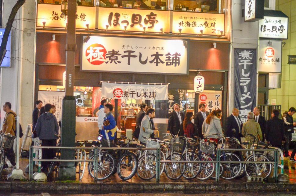 Free Image of Bicycles and Business at Night in Japan  
