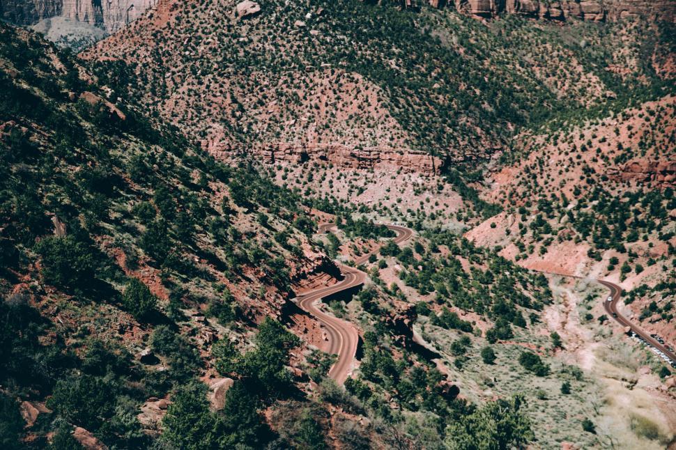 Free Image of A curvy desert highway in the day time 