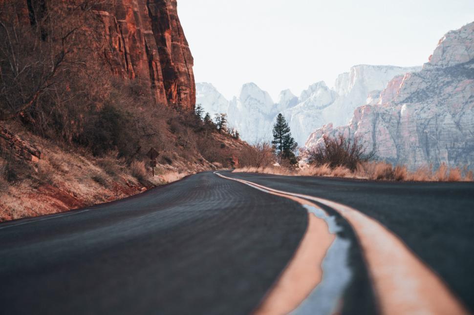 Free Image of A curvy canyon highway in the day time 