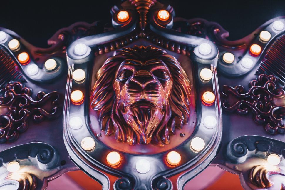 Free Image of A decorative lion head on an antique carousel 
