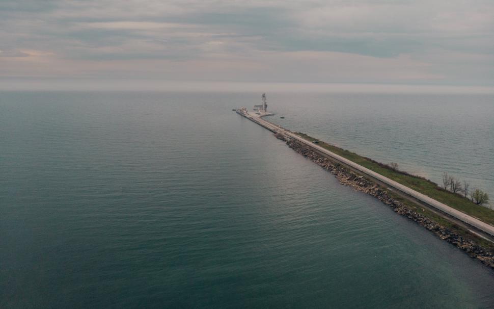 Free Image of Aerial view of a road leading to a seaport 