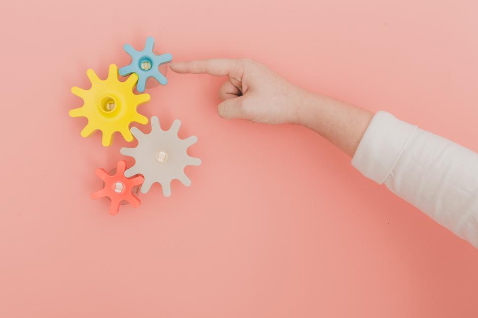 Free Image of Finger turning toy gears 
