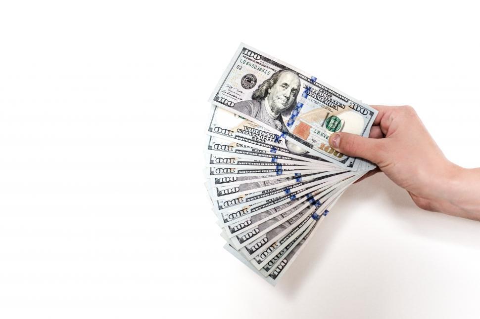 Free Image of Close up of hundred dollar bills in a hand 