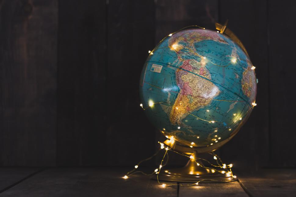 Free Image of A globe with a string of lights wrapped around it 
