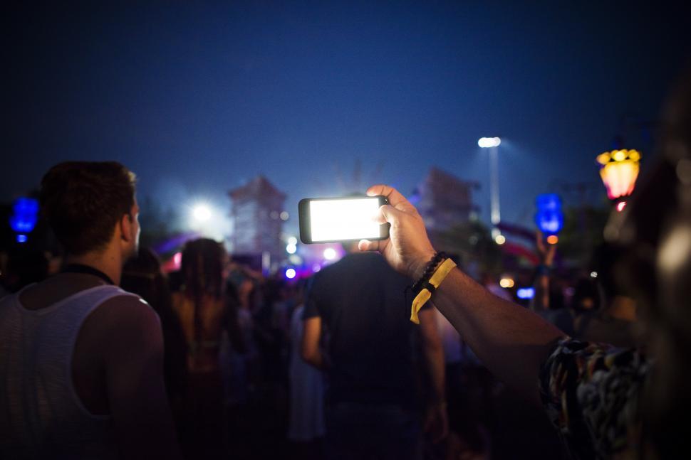 Free Image of A photograph being clicked with mobile phone in the concert crow 