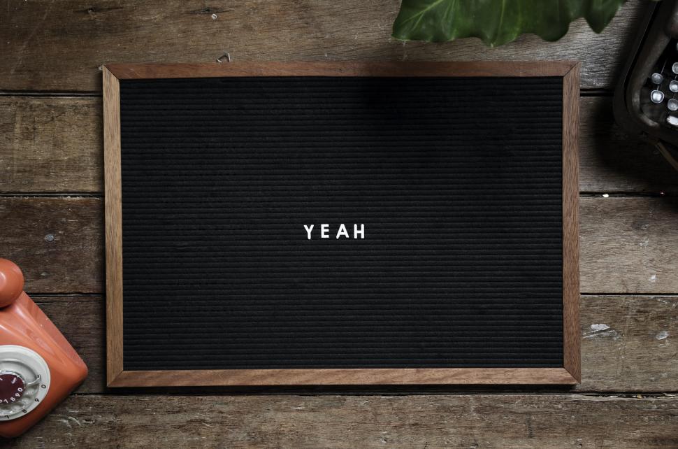 Free Image of Close up of text YEAH arranged on an old bulletin board 