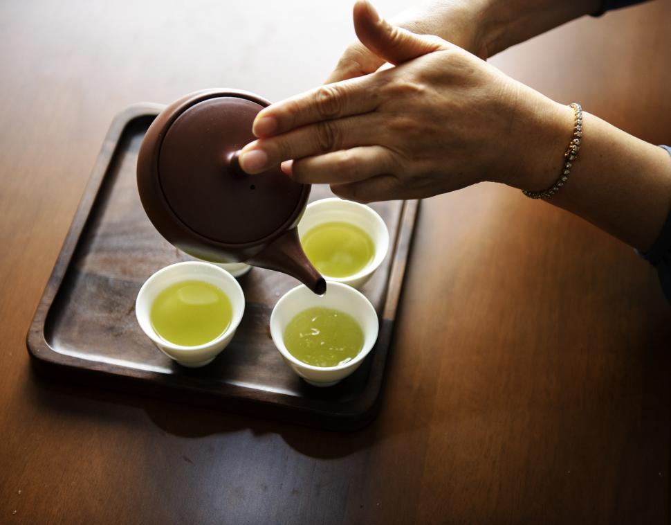 Free Image of Green tea being in traditional white cups 