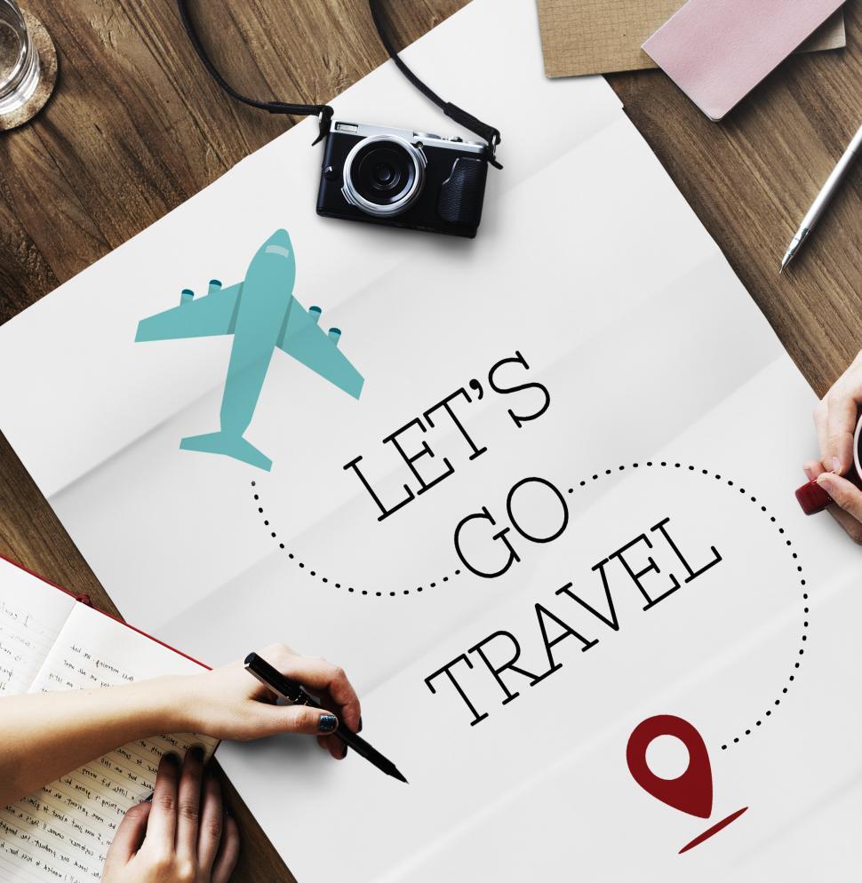 Free Image of Flat lay of a travel poster with the caption-  LET S GO TRAVEL 