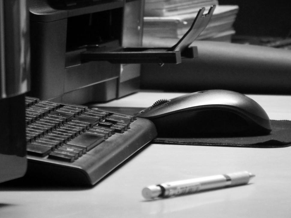 Free Image of Office equipment including keyboards, computers and printers  