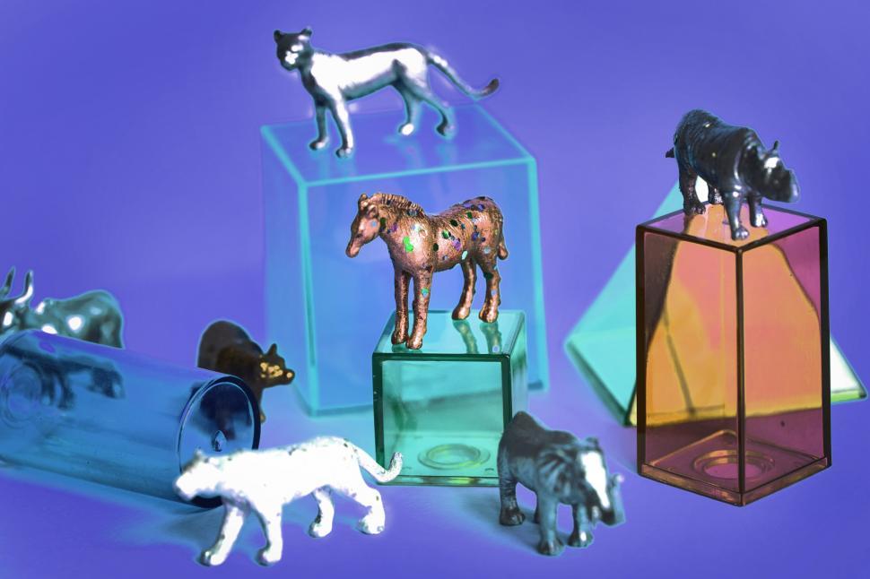 Free Image of Colorful toy animals with geometric glass figures 