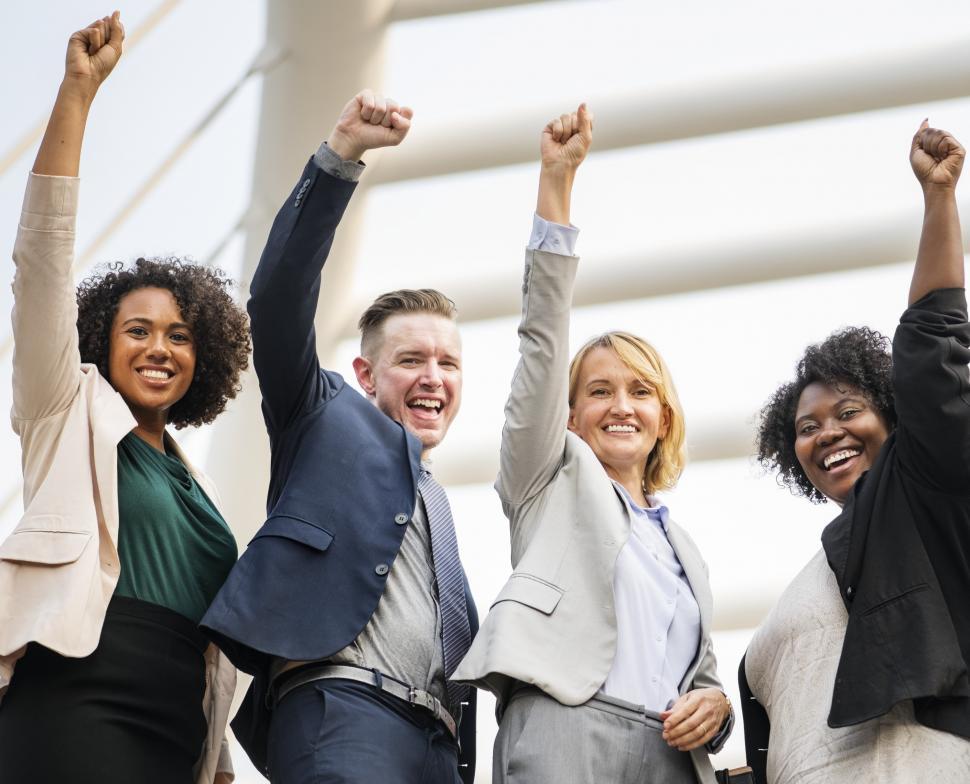 Free Image of A group of multiethnicity colleagues raising their hands in soli 