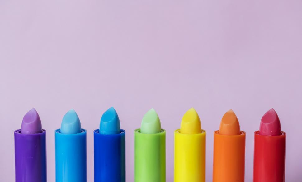 Free Image of Close up of bright colorful twisted up lip balm sticks 