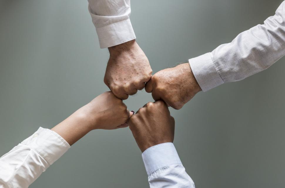 Free Image of Flay lay of hands giving Fist Bump in agreement 