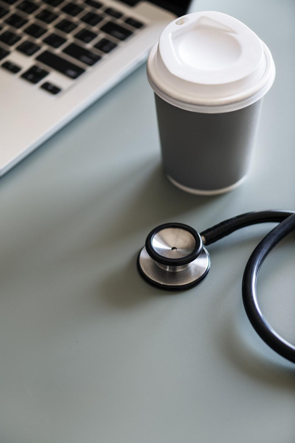 Free Image of Close up of a stethoscope alongside a coffee mug Abstract Colorful Pattern - Squares and Rectangles 