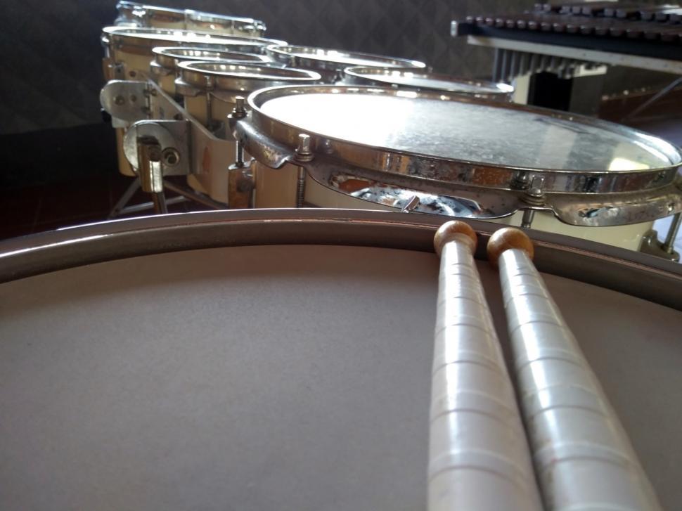 Free Image of Drum sticks resting on a drum  