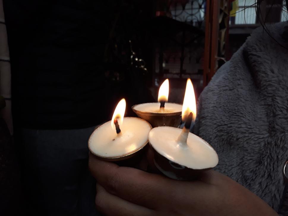 Free Image of Believe toward god - holding candles 