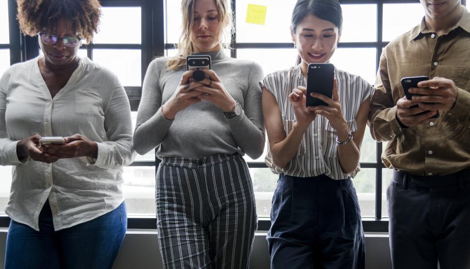 Free Image of Multiethnicity colleagues looking at their mobile phones 