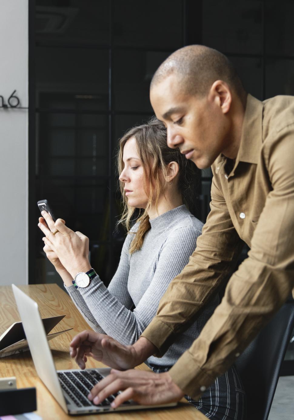 Free Image of A male and a female colleague in the office 