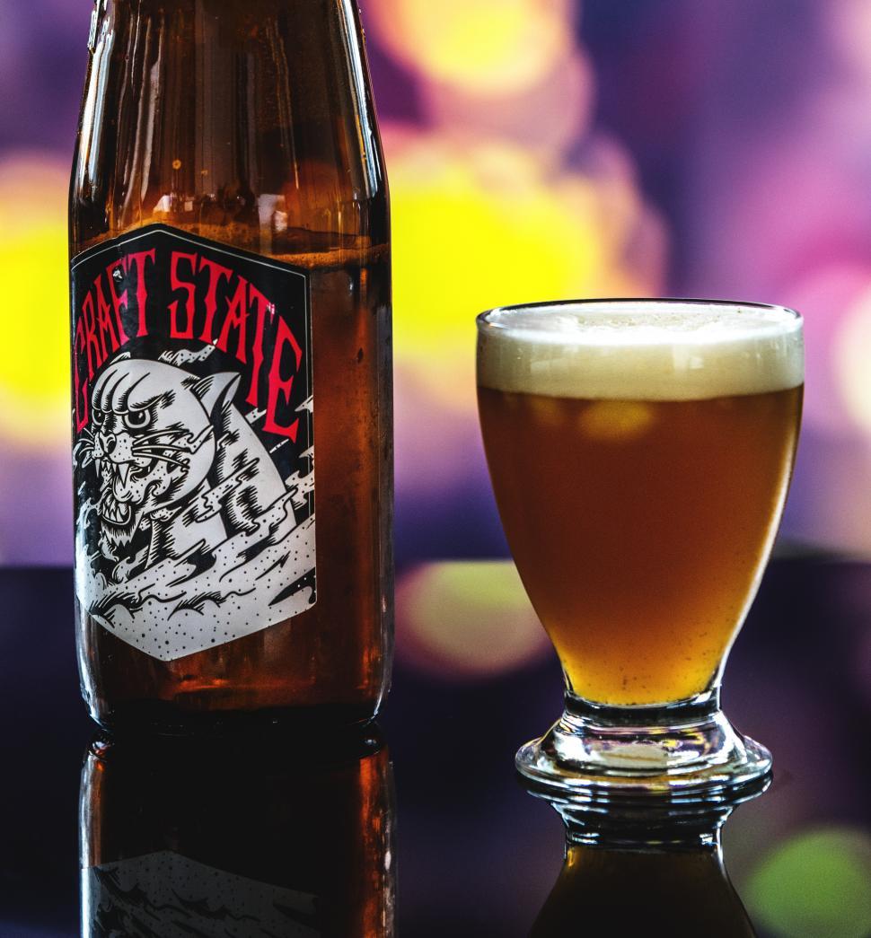 Free Image of Close up of a beer glass and a bottle 