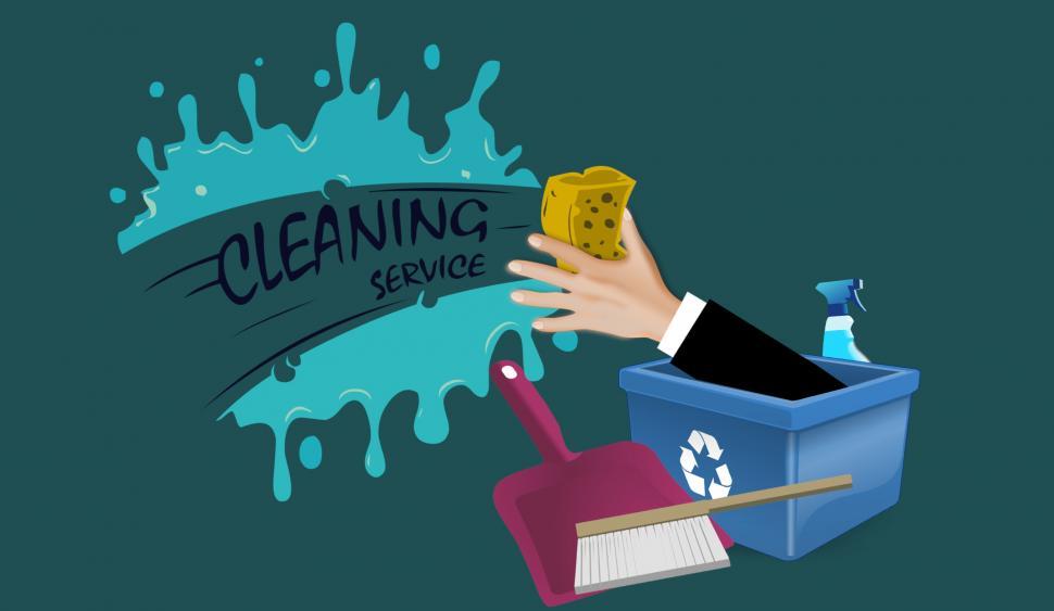 Free Image of Hand Holding Sponge and Dustpan 