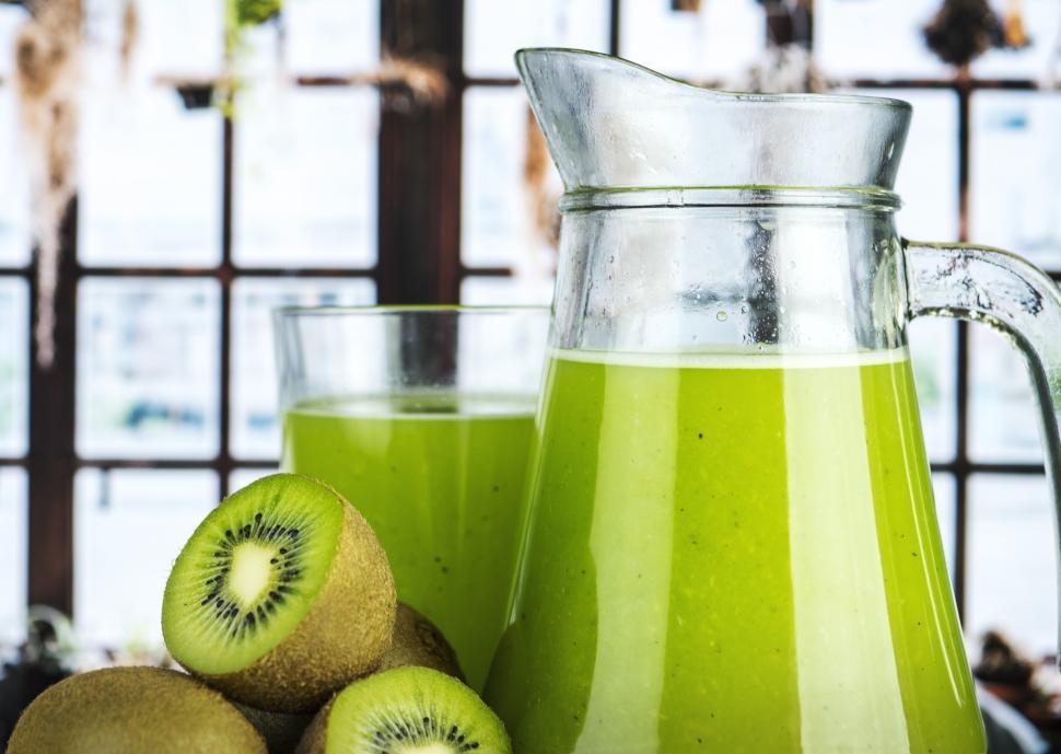 Free Image of A Full glass and a jug of kiwi juice 