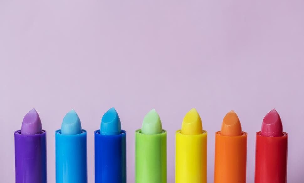Free Image of Close up of bright colorful twisted up lip balm sticks 