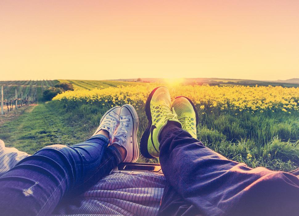 Free Image of Couple Watching the Sunset - Hazy Looks 