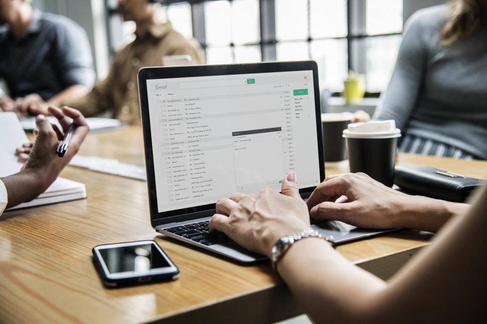 Free Image of Close up of a woman s hands writing emails 