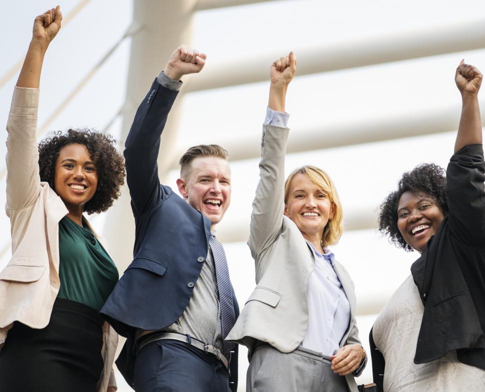 Free Image of A group of multiethnicity colleagues raising their hands in solidarity 
