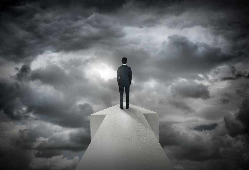 Free Image of Businessman and Dark Skies - Difficult Times Ahead - Difficult T 