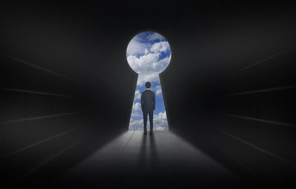 Free Image of Man and Keyhole - Opening Up a World of Possibilities 