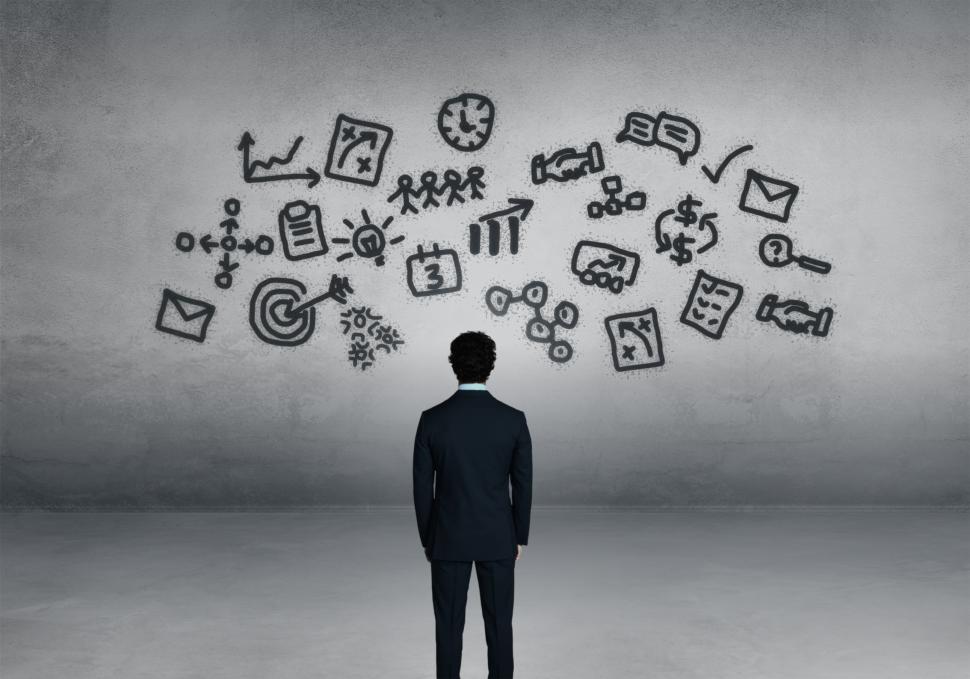 Free Image of Tasks - A Man Visualizes Tasks for the Day Ahead 