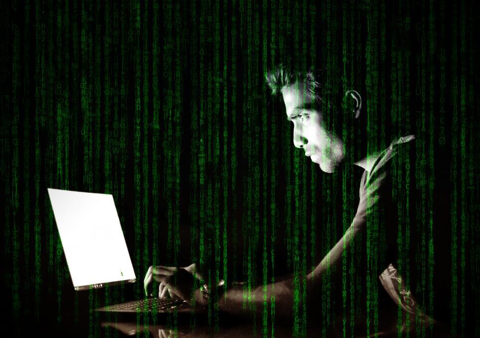 Free Image of Hacker Over Screen with Code 