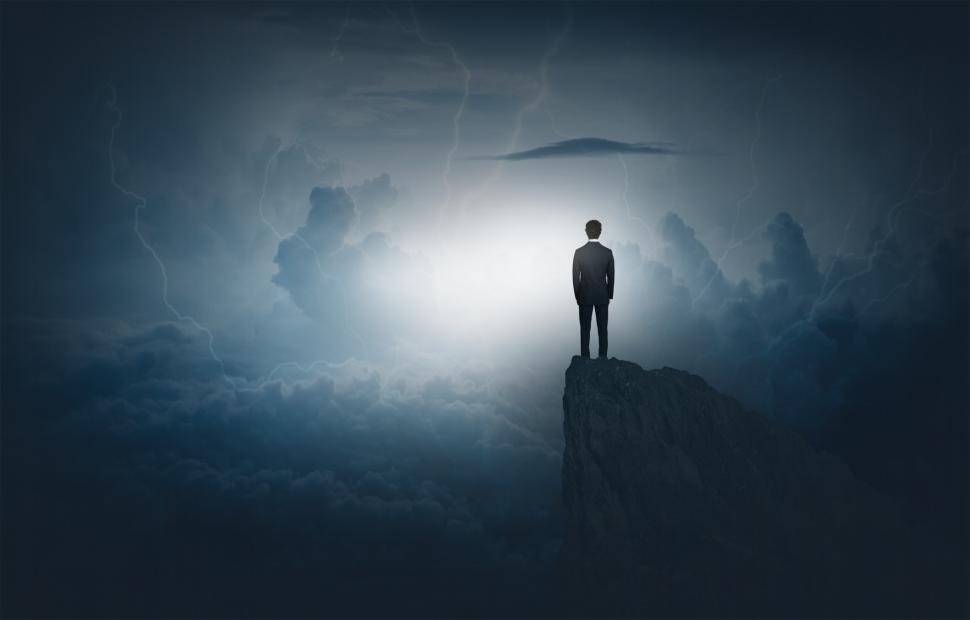 Free Image of Businessman Facing Storm on Summit - Challenges Concept 
