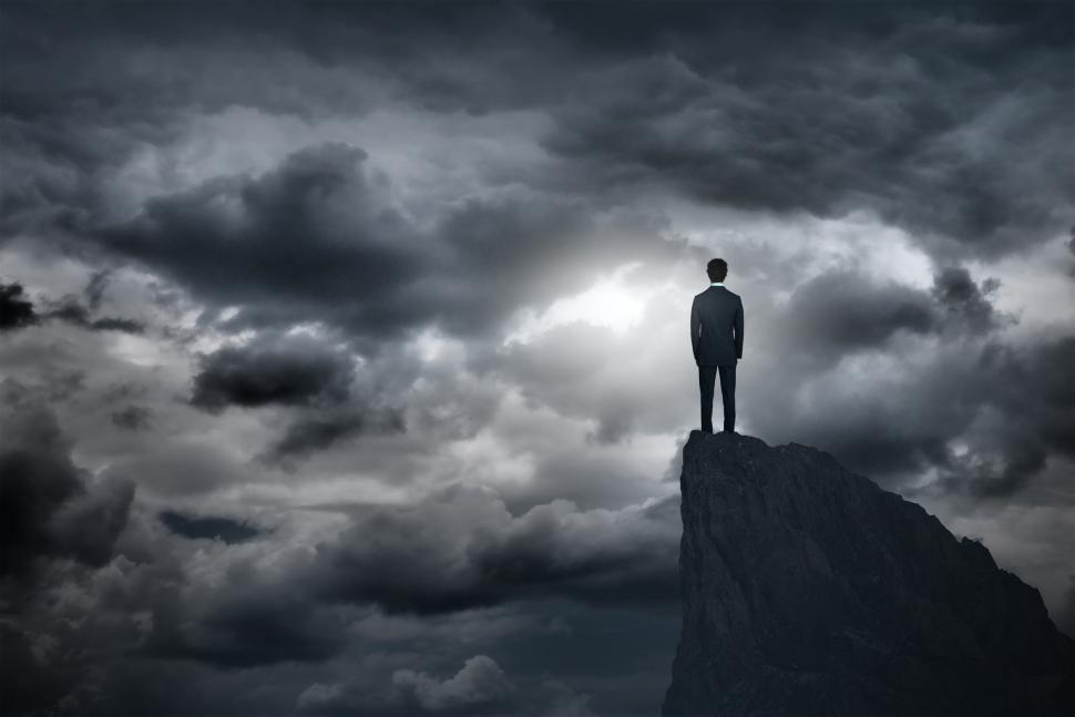 Free Image of Lone Businessman on Summit - Difficult Times Ahead 