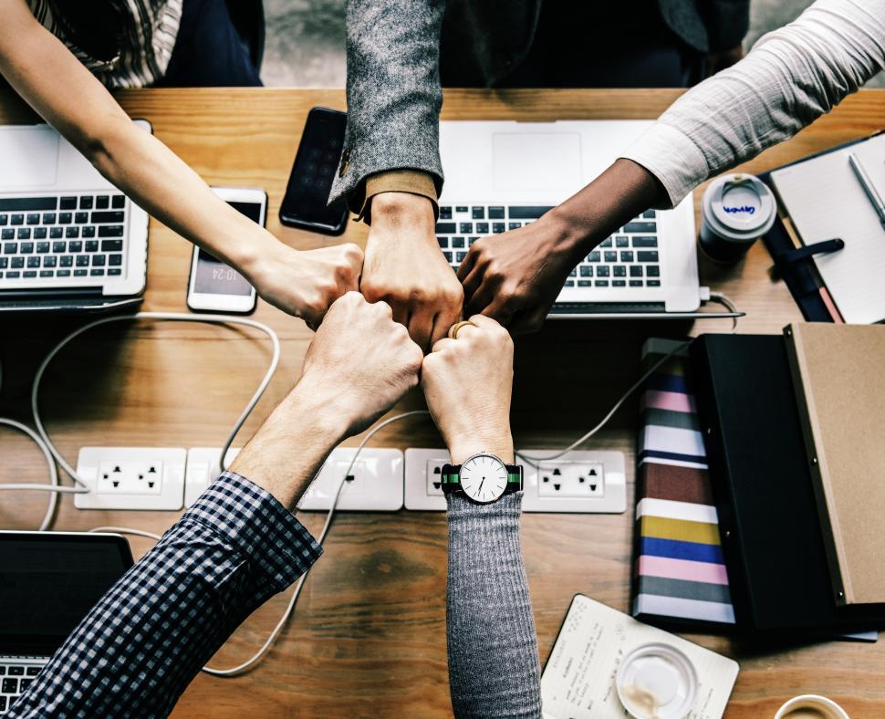 Free Image of A business team giving group Fist Bump in agreement 