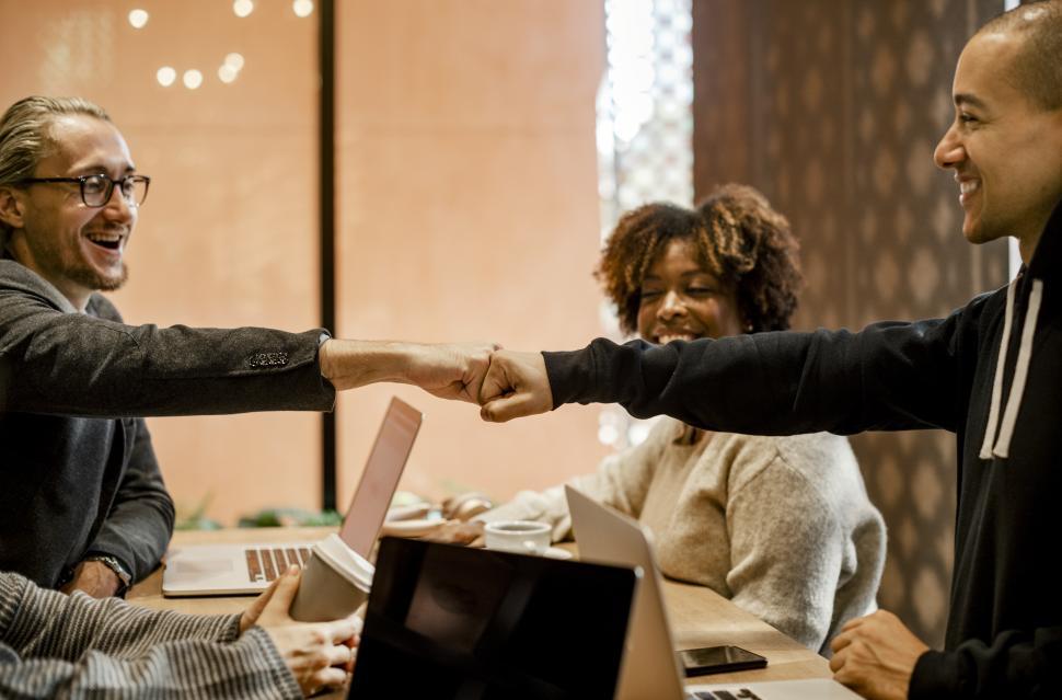 Free Image of Colleagues giving Fist Bump in agreement during meeting 