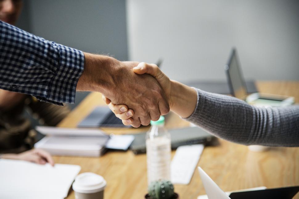 Free Image of Two people shaking hands - close view 